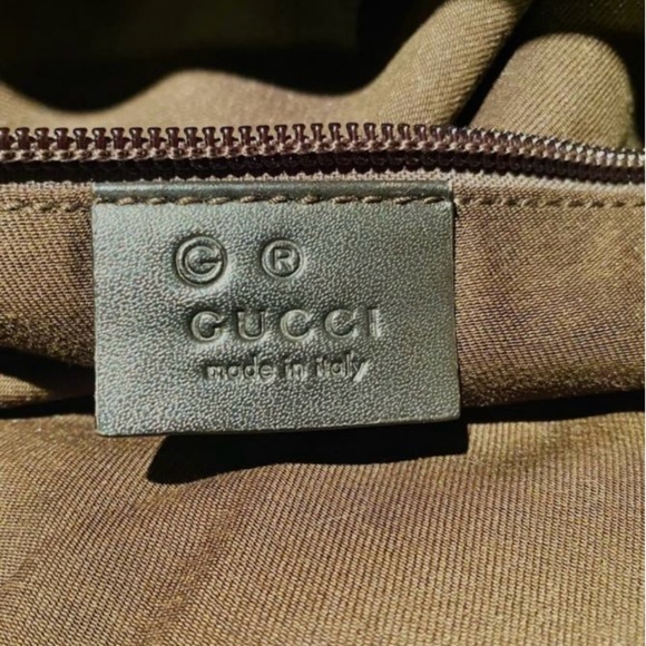 I’m selling a tan and brown Gucci overnight bag. - Picture 3 of 6